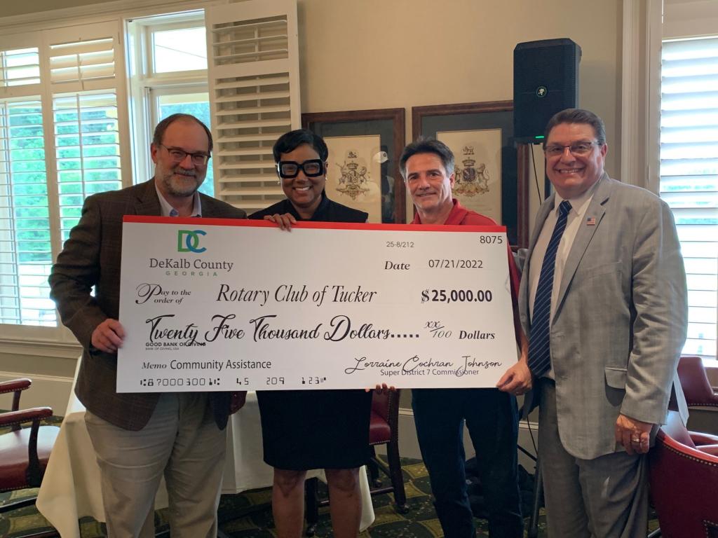 (left to right) David Fisher, executive director of NETWorks; DeKalb County Commissioner Lorraine Cochran-Johnson; Jim Rodeghiero, special events coordinator, and Kirk Fordham, director of community services, Rotary Club of Tucker, accepting the check.