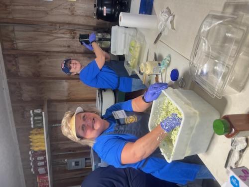 Tab Blackburn, Dist Gov Gordon Owens and Deanne Crews making candy apples.jpg