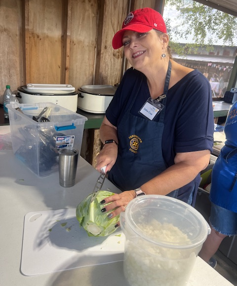 Deanne Crews cutting Cabbage for slaw.png