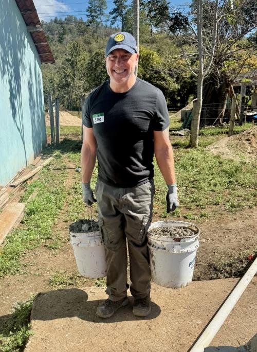 Pres Elect Joe working with cement for homes.jpg