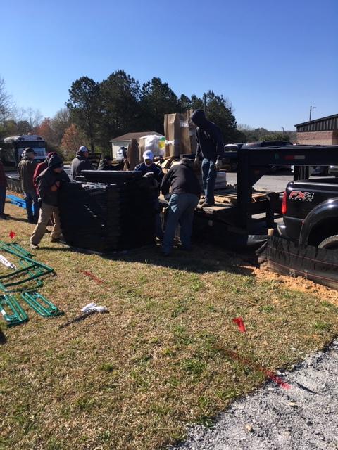 21 men off loading truck.JPG